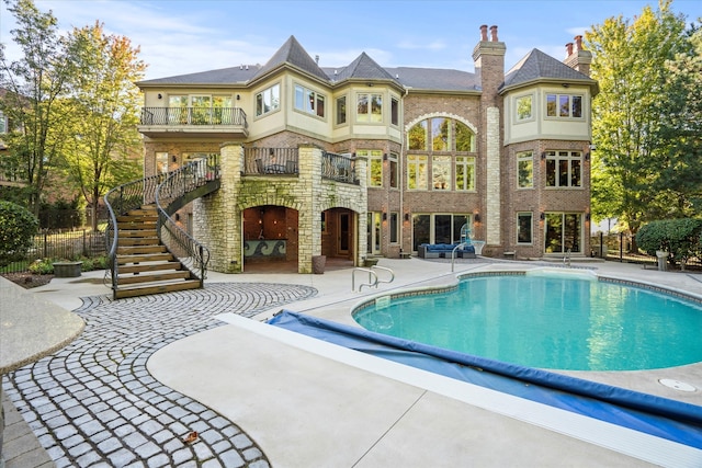 view of pool featuring a patio