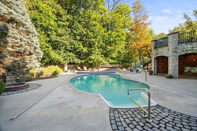 view of pool featuring a patio area