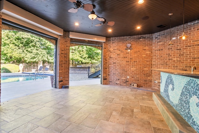 view of patio with a fenced in pool and ceiling fan