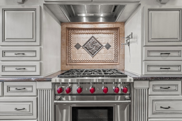 room details featuring high end stove and range hood