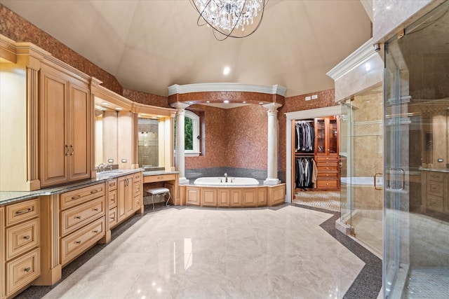 bathroom with ornate columns, lofted ceiling, a chandelier, plus walk in shower, and vanity