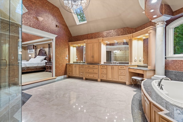 bathroom with high vaulted ceiling, shower with separate bathtub, vanity, and decorative columns