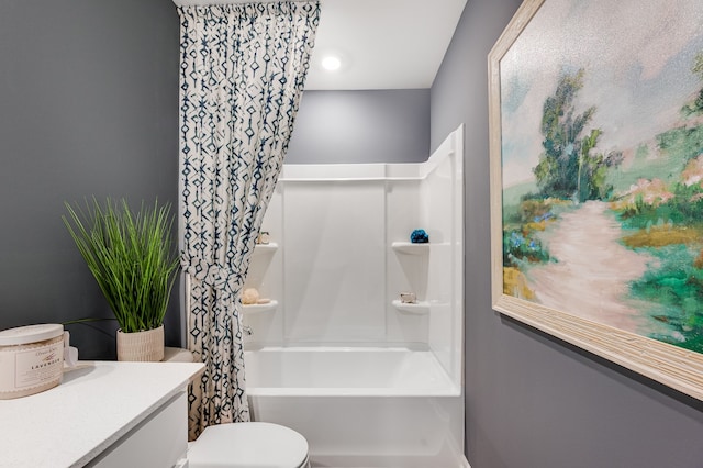 full bathroom featuring vanity, shower / bath combo with shower curtain, and toilet