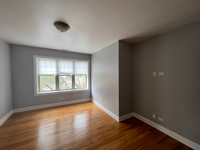 empty room with light hardwood / wood-style floors