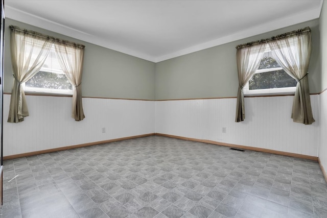 spare room featuring plenty of natural light