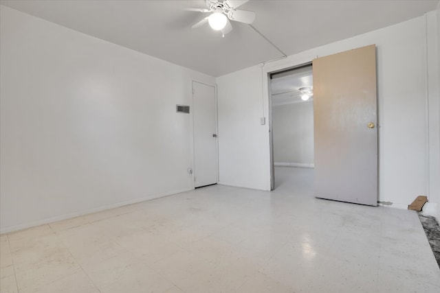 unfurnished room with ceiling fan