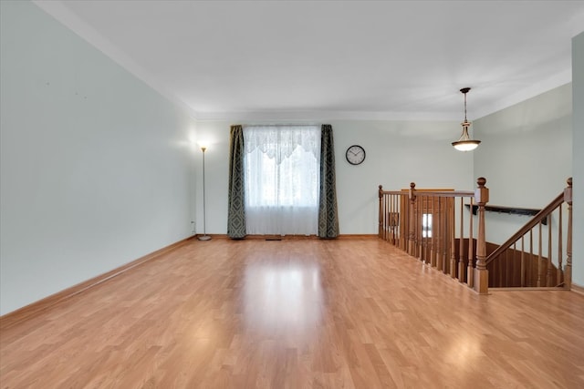 empty room with light hardwood / wood-style flooring