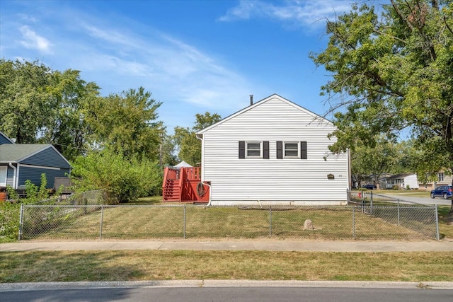 view of property exterior with a lawn