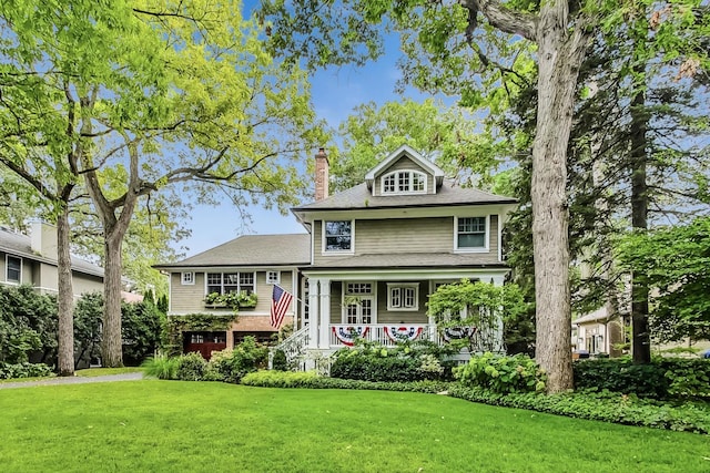 611 Elmwood Ave, Wilmette, IL 60091 - view of front of home featuring a chimney, a front yard, and a porch