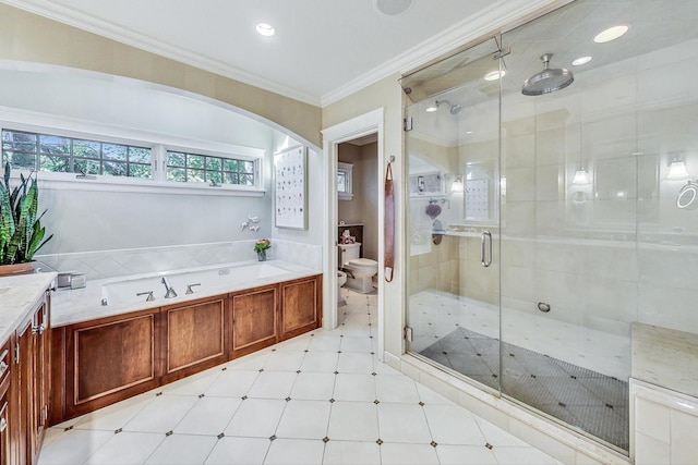 bathroom featuring crown molding, toilet, tile patterned floors, a shower stall, and a garden tub