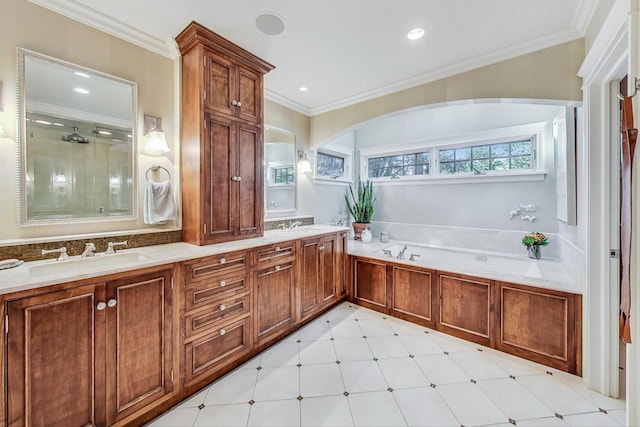 bathroom featuring crown molding, a sink, a garden tub, and a shower