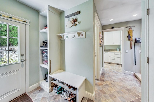 611 Elmwood Ave, Wilmette, IL 60091 - mudroom featuring recessed lighting and light stone finish flooring