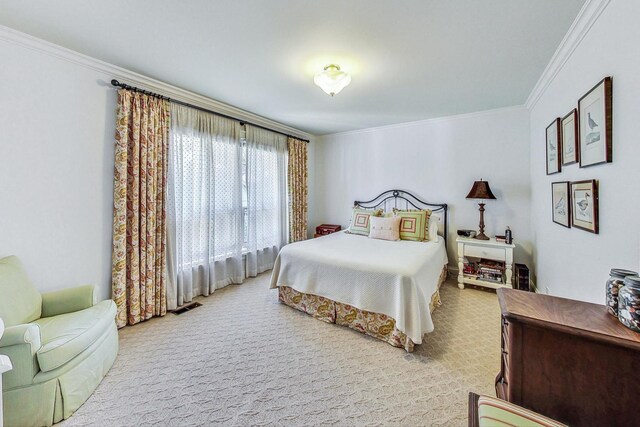 bedroom with crown molding and visible vents