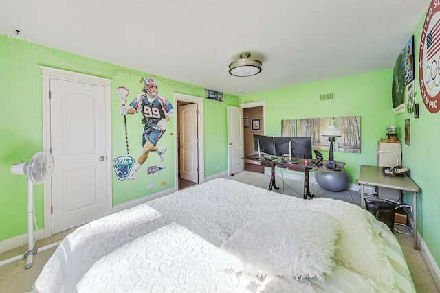 bedroom with carpet flooring, baseboards, and visible vents