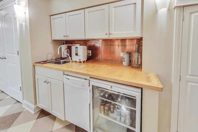 bar with backsplash, white dishwasher, beverage cooler, and light floors