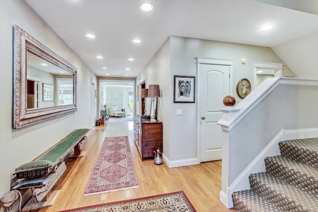 entrance foyer featuring baseboards, recessed lighting, and wood finished floors
