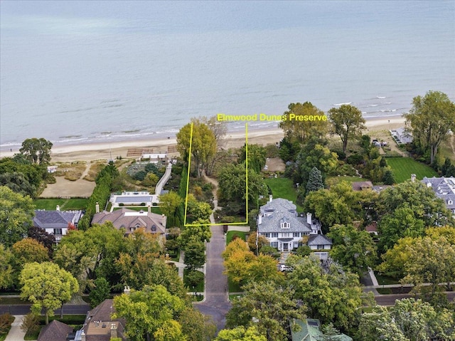 aerial view featuring a residential view, a view of the beach, and a water view