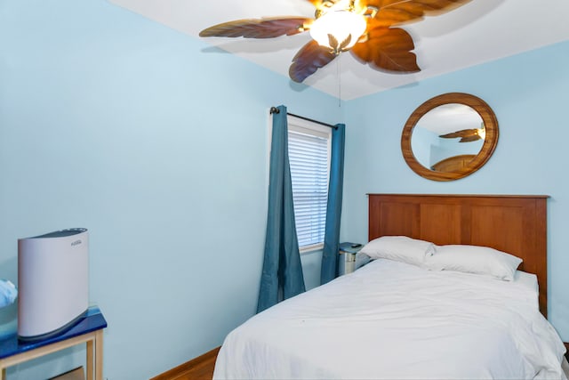 bedroom featuring hardwood / wood-style flooring and ceiling fan