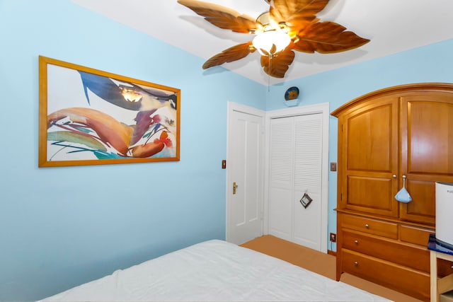 bedroom featuring a closet and ceiling fan