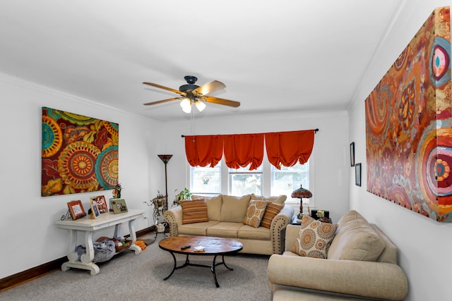 living room featuring ornamental molding, carpet flooring, and ceiling fan