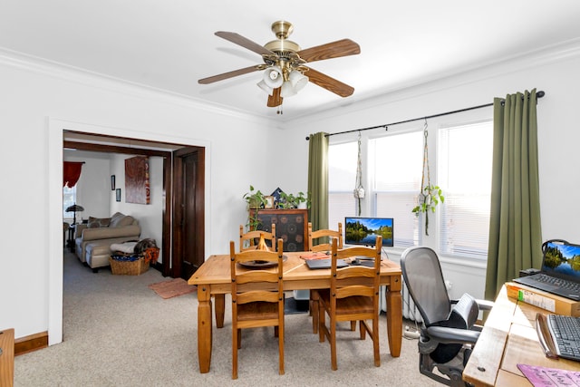 office area with light carpet, crown molding, and ceiling fan