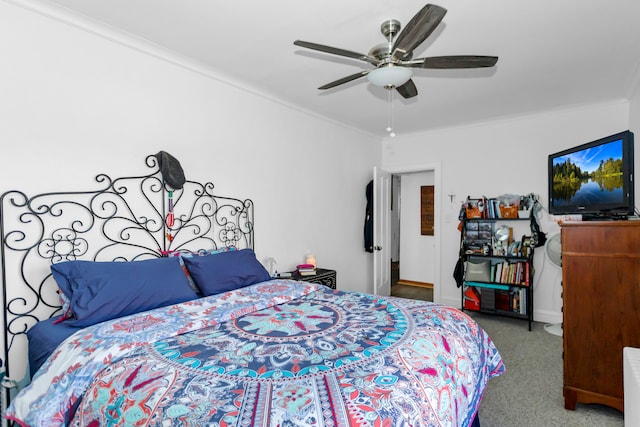 bedroom featuring ornamental molding, carpet flooring, and ceiling fan