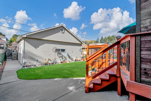 view of side of property with a lawn