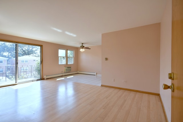 spare room featuring light wood-type flooring, ceiling fan, and baseboard heating