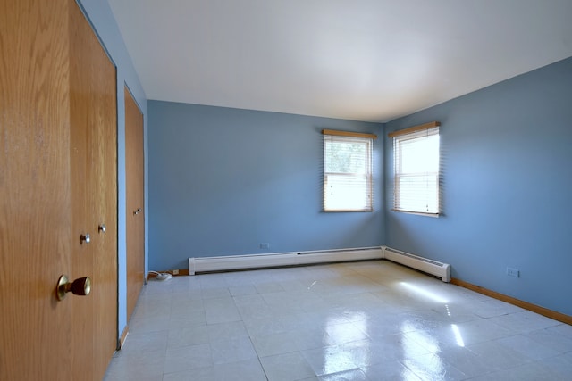 spare room featuring a baseboard radiator