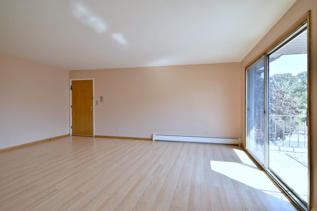 8545 Arnold St Unit 3Se, River Grove, IL 60171 - unfurnished room featuring a baseboard radiator, light wood finished floors, and baseboards