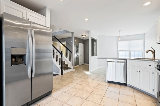 kitchen with white cabinetry, appliances with stainless steel finishes, and sink