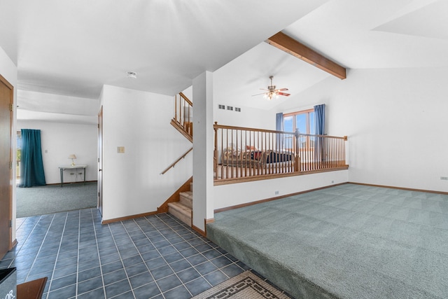 interior space featuring vaulted ceiling with beams, ceiling fan, and dark carpet