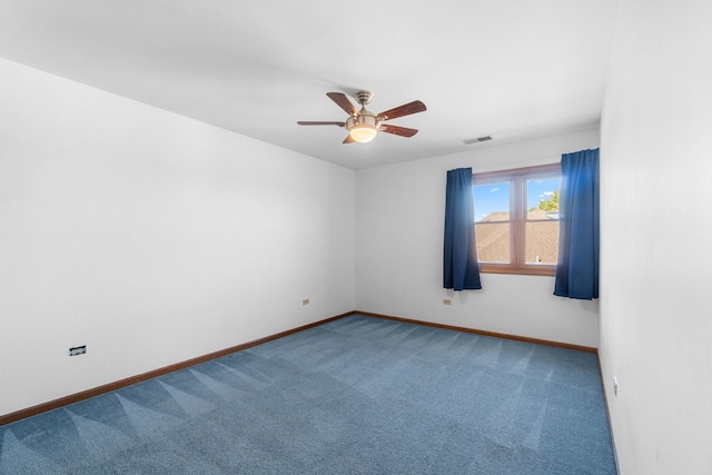 empty room with ceiling fan and carpet flooring