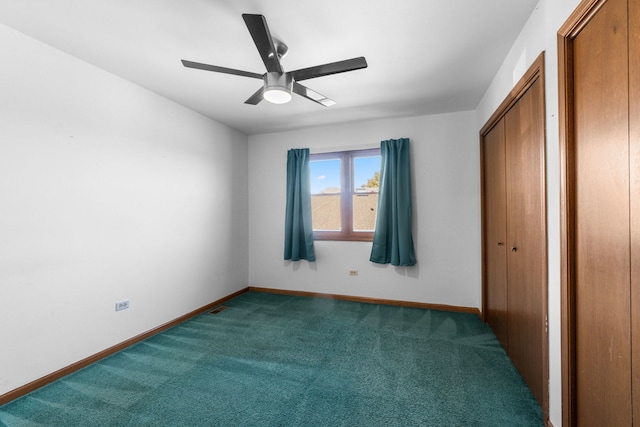 unfurnished bedroom featuring ceiling fan and carpet floors