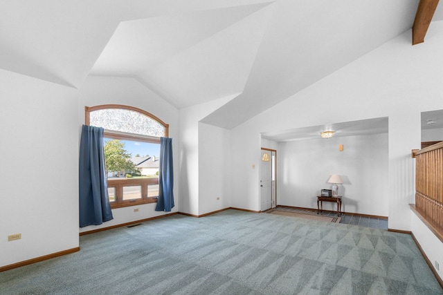 unfurnished living room featuring carpet floors and high vaulted ceiling