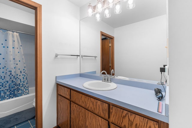 full bathroom featuring vanity, shower / bath combo with shower curtain, tile patterned flooring, and toilet