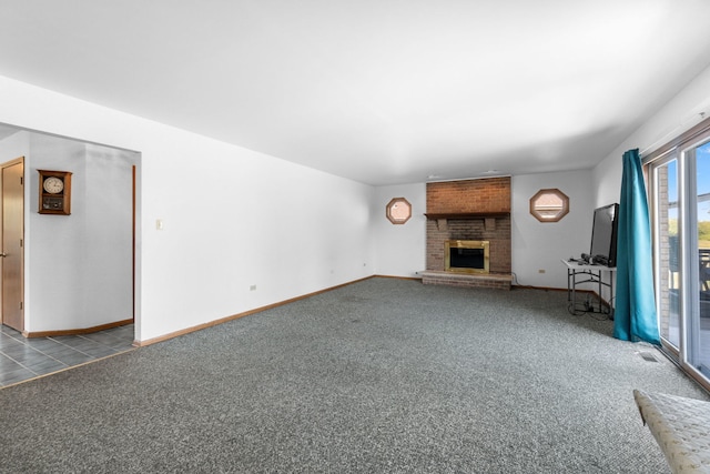 unfurnished living room with a brick fireplace and carpet flooring