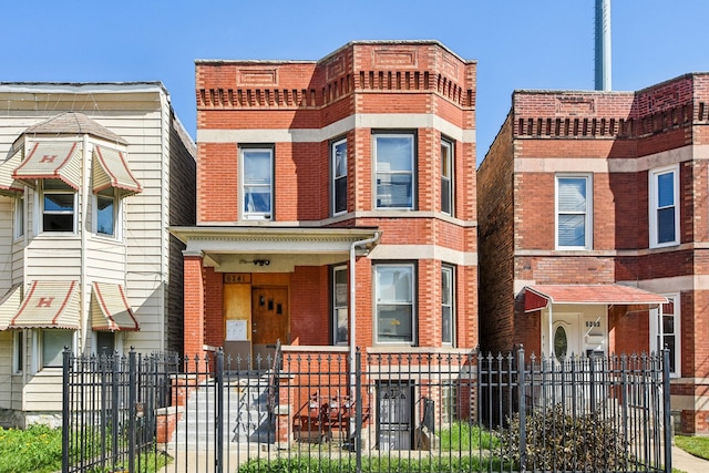 townhome / multi-family property with a porch