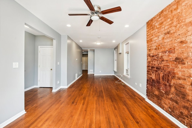 empty room with ceiling fan and wood-type flooring