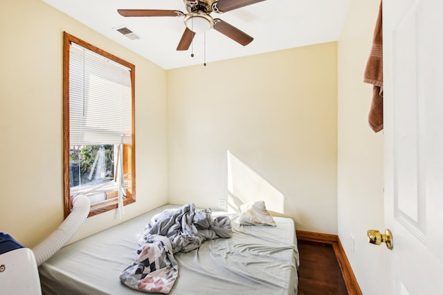 bedroom featuring wood-type flooring and ceiling fan