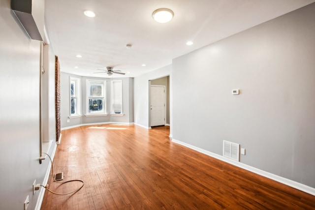 unfurnished living room featuring light wood-type flooring and ceiling fan