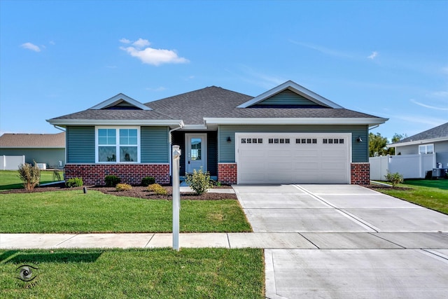 view of front of home featuring a garage and a front lawn