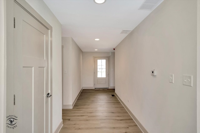 hall with light wood-type flooring