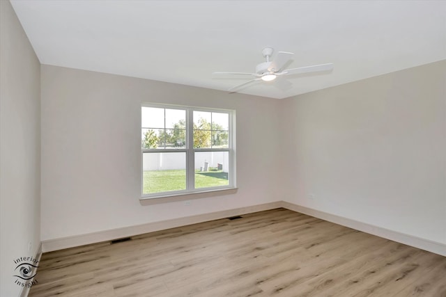 empty room featuring ceiling fan and light wood-type flooring