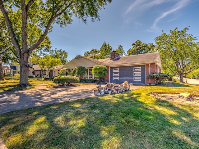 ranch-style home with a front lawn