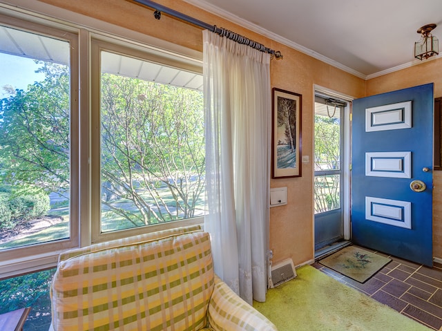 entrance foyer featuring crown molding