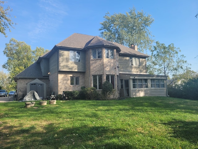 back of property with a sunroom and a lawn