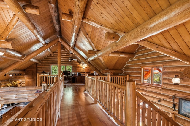 hall with wooden ceiling, hardwood / wood-style flooring, log walls, and vaulted ceiling with beams