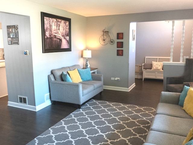 living room featuring dark hardwood / wood-style flooring