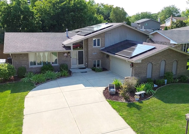 view of front of house featuring solar panels and a front lawn